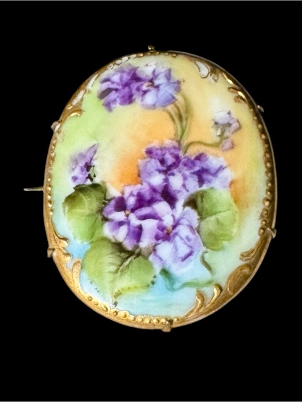 Amazing hand painted 1920’s porcelain brooch purple violets